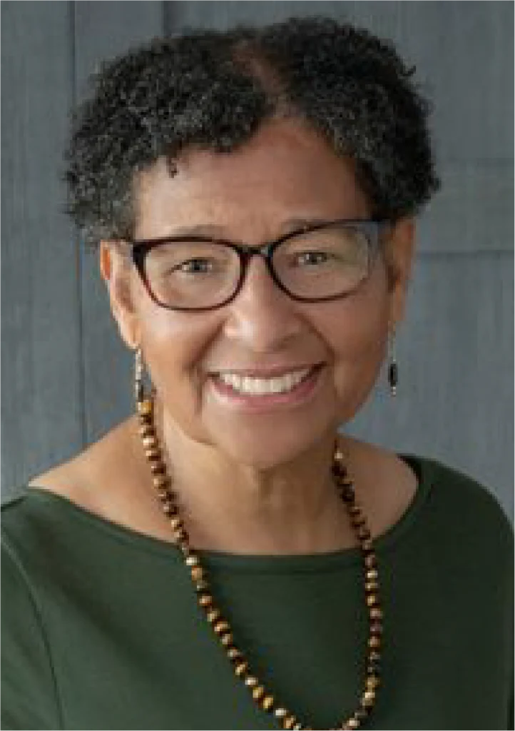 A woman with glasses and a necklace